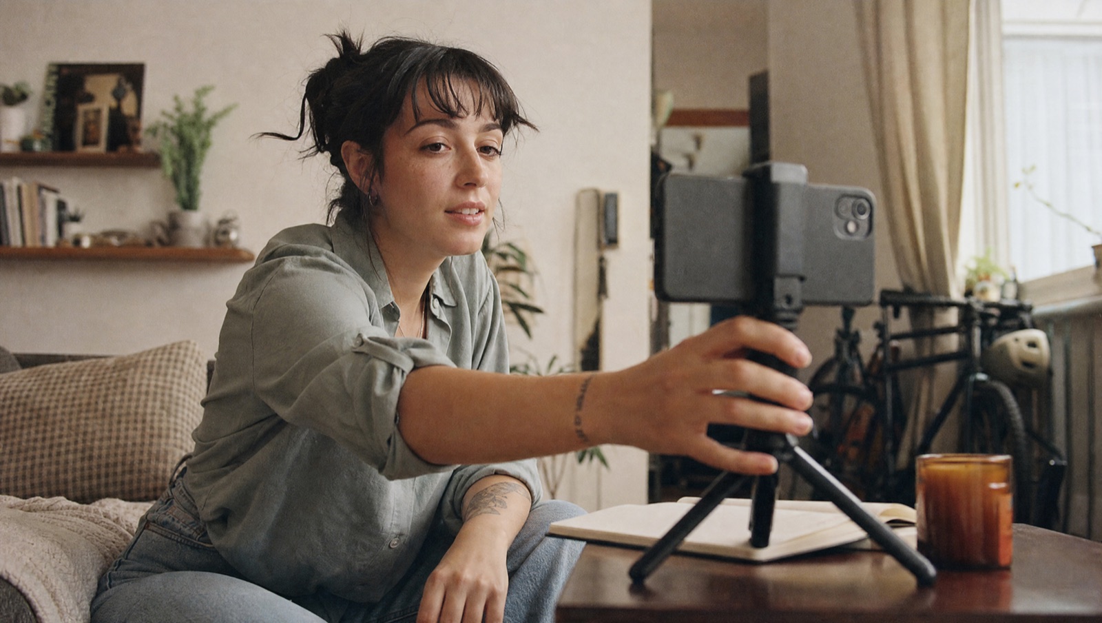 A content creator filming in a modern studio